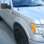 Before and after photographs of a damaged Ford pickup truck that was repaired by Elite Paint & Body Shop in West Palm Beach, Florida.